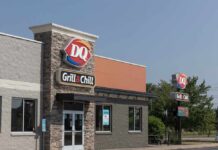 Corporate Axe Drops — Many DQs Gone Dairy Queen Grill & Chill restaurant exterior on a sunny day