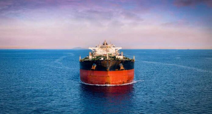 Oil tanker ship on open sea at dusk