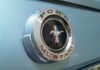 Ford Mustang emblem on a light blue car