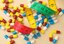 $50 Weight-Loss Tease — Who Actually Qualifies? Colorful capsules scattered with a measuring tape