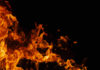 Orange flames against a dark black background