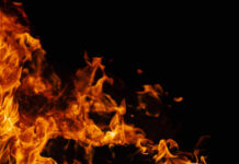 Orange flames against a dark black background