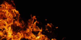 Orange flames against a dark black background