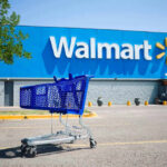 Shopping cart in a Walmart parking lot.
