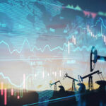 Oil pumps and financial charts against world map