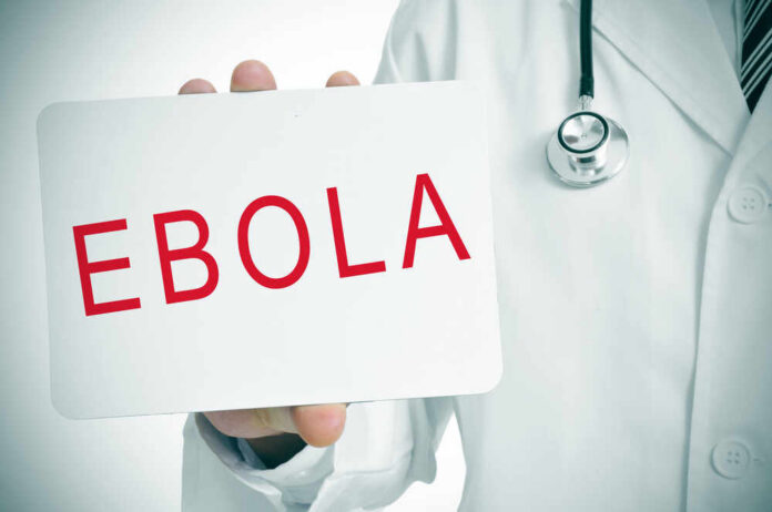 Doctor holding a sign about Ebola