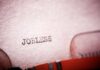 Jobs Shock Rattles Trump’s Midterm Play Close-up of a typewriter with the word 'JOBLESS' typed on paper
