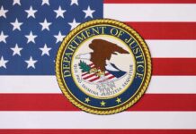 Judge Slaps DOJ’s ‘Vibes’ Dismissal Department of Justice seal on American flag background