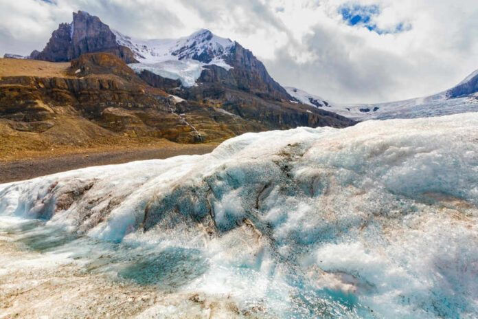 Snowy mountain landscape with glacial ice and rocks