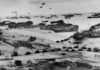 Allied landing on Normandy beach during D-Day, WWII.