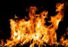Bright orange flames against a black background