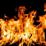 Bright orange flames against a black background