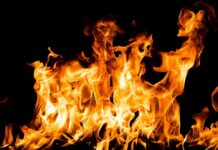 Bright orange flames against a black background