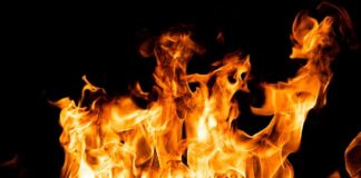 Bright orange flames against a black background