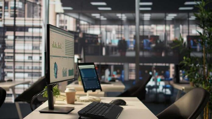 Luxurious,Business,Environment,Used,In,Corporate,Culture,And,The,Industry, Computer monitor with analytics dashboard in a modern open office