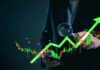Business professional analyzing stock market trends with a magnifying glass