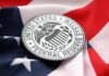 Federal Reserve System emblem on an American flag