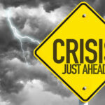 Red Sea Turns Deadly — What Changed? Yellow sign reading Crisis Just Ahead with stormy sky