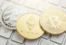 Crypto Bets Torch Trump Media Litecoin, Ethereum, and Bitcoin coins on a keyboard.