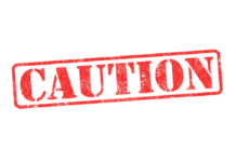 Eight-Story Plunge By College Girl – DETAILS Red caution sign with grunge texture diagonal