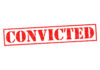 Red stamped text convicted on white background