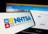 NHTSA Flags Ford Vehicles AGAIN! NHTSA logo displayed on a smartphone screen