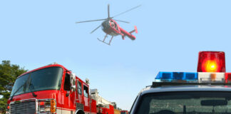 Fire truck police car and helicopter at scene
