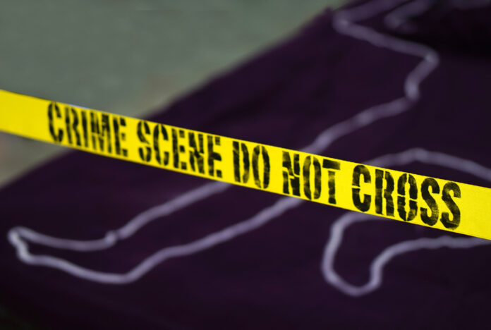 Crime,Scene,-,Do,Not,Cross.,Chalk,Outline,Of,Murdered Yellow crime scene tape marking off an area with a chalk outline