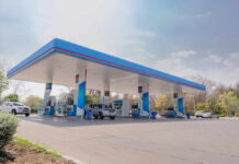 Diesel Shock Blows Past Record A modern gas station with fuel pumps and parked vehicles