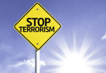 Terror Probe Erupts at U.S. Military Base Stop terrorism sign