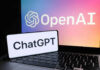 OpenAI ChatGPT logos on laptop and smartphone screens.