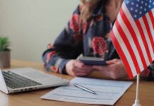 Permanent resident card and official letter on an American flag background