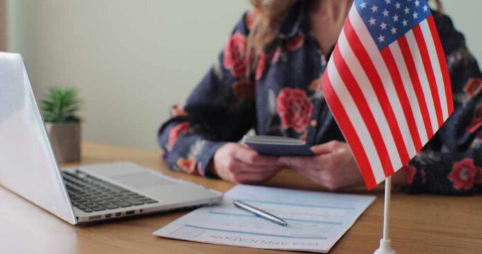 Permanent resident card and official letter on an American flag background