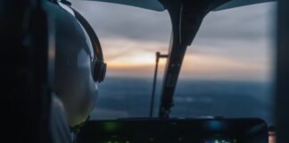 Pilot's view from a helicopter cockpit during sunset