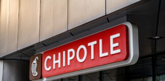 restaurant storefront sign with red panel and logo