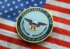 Hegseth Order Shakes Up War Department Seal of the Department of War on an American flag background