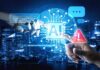 Robot hand and human hand touch a glowing AI interface over a cityscape