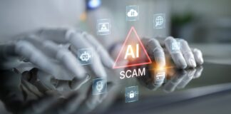 Robot hands hovering over a tablet with AI scam warning icons