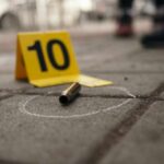 Doorbell Camera Catches Killer’s Deadly Act Bullet casing on the ground next to a numbered evidence marker