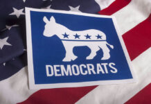 PROOF: Dems Back Force Against Trump Democratic Party donkey logo on American flag background.