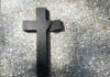 VIDEO: Livestream Horror Stuns Parish Broken black cross on a gray surface.