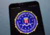 Espionage Bombshell Hits FBI Director FBI logo displayed on a smartphone screen