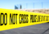 Bus Stop Horror Sparks Court Uproar Police do not cross tape stretched across an outdoor scene