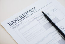 Bankruptcy Chapter 13 form with a pen resting on it