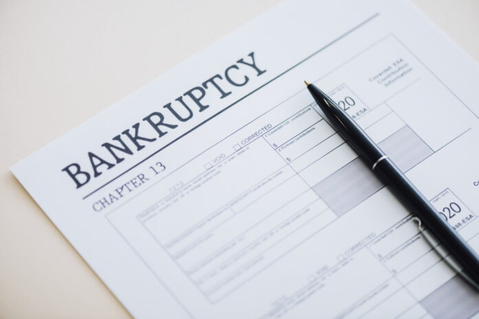 Bankruptcy Chapter 13 form with a pen resting on it