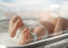 Hospital Paperwork Hides $1,000 Catch Newborn baby in hospital bassinet with ID band.