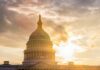 The Capitol building in Washington D.C. silhouetted against a sunset