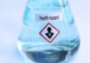 Flask labeled Health hazard with warning symbol.