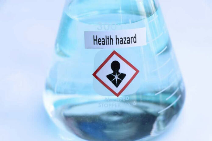 Flask labeled Health hazard with warning symbol.