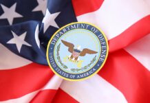 Department of Defense emblem on American flag